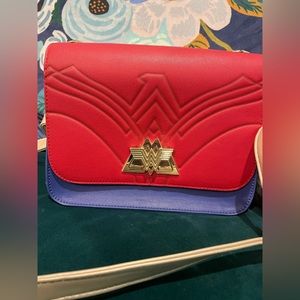 Loungefly DC Wonder Woman 1984 crossbody bag in blue and red with gold strap